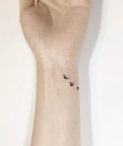 15+ Of The Best Bird Tattoo Ideas Ever Small Tattoos Birds Simple, Mini Tattoos Bird, Min Tattoo Ideas, Dainty Bird Tattoos For Women, Tiny Tattoos For Moms, Bird Wrist Tattoo, Dainty Bird Tattoos, Tiny Bird Tattoo, Golondrinas Tattoo