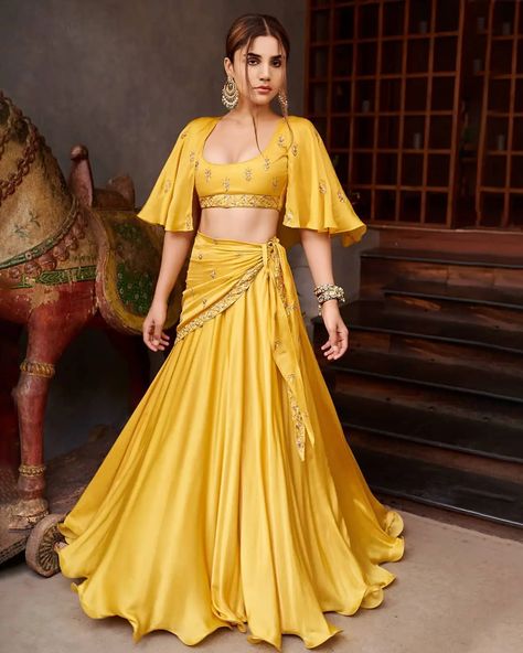 40 Latest and Trendiest Haldi Dress Options For The Bride and Her Sisters Yellow Crop Top Lehenga, Lehenga Skirt With Crop Top, Mustard Yellow Lehenga, Prathyusha Garimella, Crop Top With Skirt, Designer Crop Top, Orang India, Ceremony Outfit, Haldi Ceremony Outfit