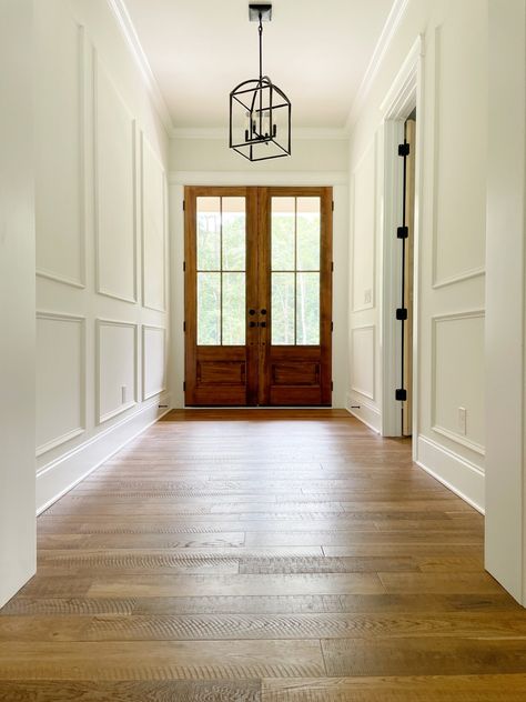 Wainscoting Entry Way, Hallway Crown Molding Ideas, Foyer Molding Entryway, Frame Molding Hallway, Traditional Picture Frame Molding, Hallway Framing Ideas, Wall Paneling Foyer, Entryway With Molding, Foyer Millwork Ideas