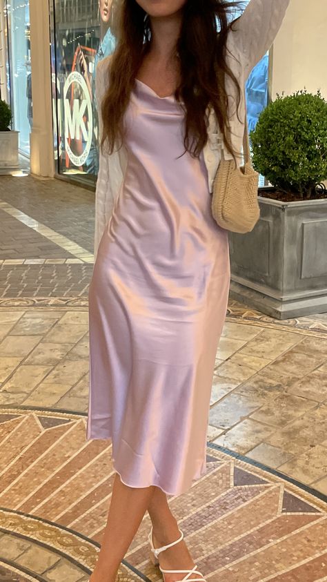 Silk dress with a crochet bag and claw clip in Los Angeles Pink Slip Dresses, Aesthetic Birthday Party Outfits, Pink Silk Midi Dress, Silk Light Pink Dress, Pink Slip Dress Aesthetic, Silk Satin Prom Dress, Pastel Silk Dress, Pale Pink Dress Outfit, Prom Dress With Cardigan