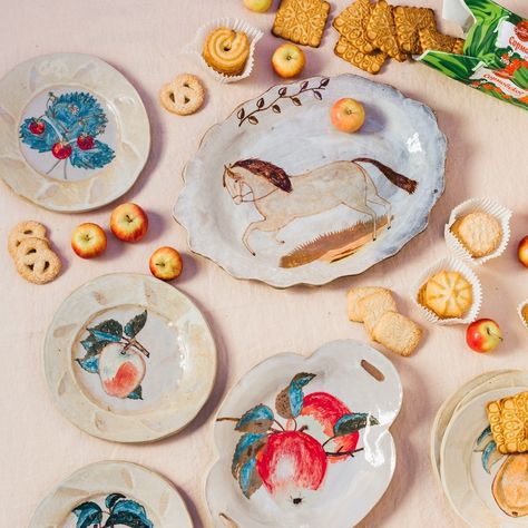 Hand painted plates by Rebekah Miles on a pale pink table cloth with apples and cookies. Rebekah Miles Ceramics, Apple Painting, Fall Gathering, Fall Table, Ceramic Dishes, Flora And Fauna, Salad Plates, Ceramic Cups, Holiday Celebration