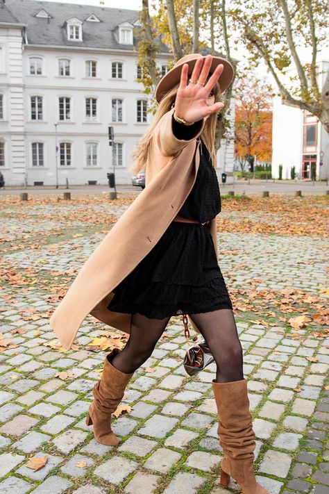 A pretty easy outfit today, with a lovely Loavies black dress and camel accessories.You probably now those Stradivarius boots now. What I love about it, is that you can wear them either as thigh high boots or just under the knees.    Hat : The Kooples  Coat : Comptoir des Cotonniers  Dress : Loavies  Belt : H&M  Boots : Stradivarius  Bag : Zara    #fallootd #falloutfit #falllook #streetstyle #parisianstyle #idéelook #tendancemode #lookautomne Tan Boots And Belt, Taupe Long Boots Outfit, Tan Calf Boots Outfit, Camel Tall Boots, Tan Knee Boots Outfit, Khaki Knee High Boots Outfit, Camel High Boots Outfit, Knee High Beige Boots Outfit, Long Tan Boots Outfit