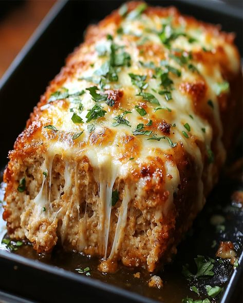 Try this Golden-Baked Parmesan Chicken Meatloaf with a mozzarella crust. Delicious, easy to make, and perfect for a family dinner. Chicken And Pork Meatloaf, Crowd Lunch Ideas, Breaded Parmesan Chicken, Garlic Chicken Meatloaf, Parmesan Chicken Meatloaf, Garlic Parm Chicken Meatloaf, Garlic Parmesan Meatloaf, Healthy Mozzarella Recipes, Italian Dinner For A Crowd