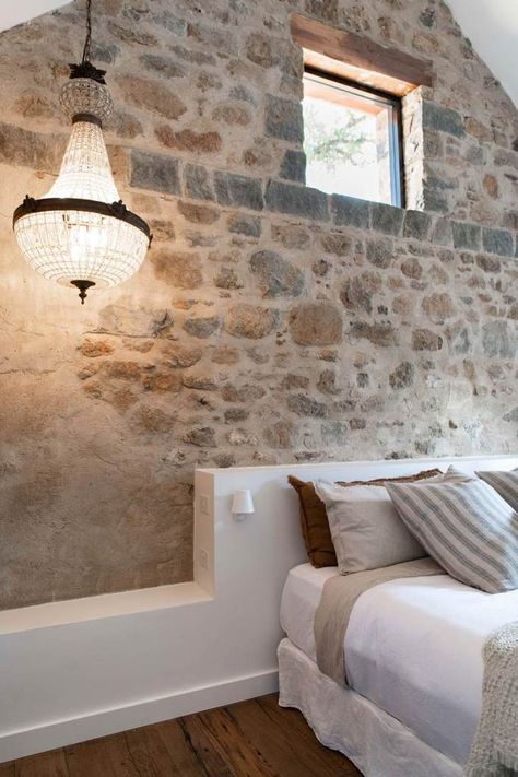 Stone feature walls: 12 stunning designs Exposed Stone Walls Interior, Internal Stone Wall, Exposed Stone Wall Interior, Stone Wall Bedroom, Cottage Interiors Bedroom, Interior Stone Wall Ideas, Indoor Stone Wall, Stone Cottages Interior, Stone Wall Interior Design