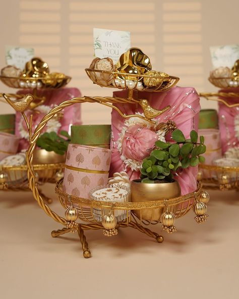 Celebrating Smriti’s Roka with a touch of tradition! Our customised hampers in sage green and baby pink add a perfect blend of elegance and charm to this special occasion. 🦢🪞🪷 DM or text us at 9582875455 for more details!💗 [ weddingfavours Indianwedding gifting bridesmaidproposal groomsmanproposal] #weddingseason #returngifts #teambride #teamgroom #explore #explorepage #weddinggifts #CustomHampers #RokaCeremony Indian Wedding Hampers, Wedding Packings, Gifting Hampers, Diwali Hampers, Wedding Hampers, Hampers Ideas, Gift Arrangement, Diwali 2024, Diwali Ideas