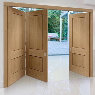 Thrufold Piacenza Oak 2 Panel Flush 2+1 Folding Door - Groove Design - Lifestyle Image    #foldingdoors Glazed Windows, Folding Door, Cosy Living, Cosy Living Room, Double Glazed Window, Folding Doors, Door Frame, Joinery, Tall Cabinet Storage