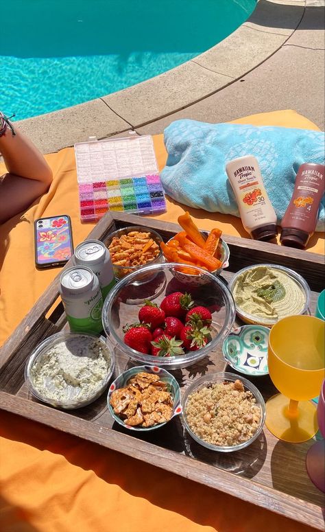 This pin shows a poolside picnic tray. There are strawberries, bell peppers, pretzels and other spreads. The picture has a lot of orange and blue tones. Beach Trip Food, Friendship Vacation, Tanning Beach, Hawaiian Tropic, Pool Day, Summer Swim, Coconut Girl, Crafts Jewelry, Pool Days