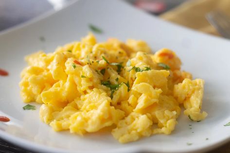 Whether prepared with sauteed vegetables or not, this foolproof method produces fluffy scrambled eggs for breakfast every time. Best Scrambled Eggs, Eggs Scrambled, Creamy Scrambled Eggs, Fluffy Scrambled Eggs, Scrambled Eggs Recipe, Fried Foods, Egg Dish, Most Popular Recipes, Breakfast Dishes