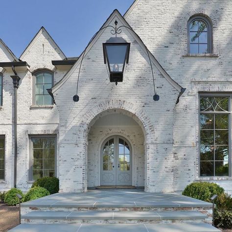 Stone And Painted Brick House Exterior, German Shmere Brick House, Black Gutters, Painted Brick House Exterior, Lime Wash Brick, Stone Entryway, Painted Brick Exteriors, Brick Archway, Painted Brick House