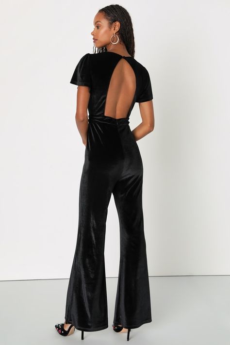 You'll be at the top of the style ranks when you arrive at your next event in the Lulus Classy Darling Black Velvet Keyhole Cutout Backless Jumpsuit! Soft and stretchy velvet shapes this effortlessly cool jumpsuit with a crew neckline and a darted bodice with a flirty keyhole cutout at the center, all framed by short flutter sleeves with puff shoulders. A high, banded waist sits atop wide pant legs that end at ankle-length hems. Turn around to reveal a sultry open back design that secures with a top button closure. Hidden back zipper/clasp. Fit: This garment fits true to size. Length: Floor length. Size medium measures 60" from shoulder to hem. Inseam: 32.25 Front Rise: 12.50 Bust: Great for any cup size. Waist: Fitted - very fitted at natural waist. Hip: Loosely Fitted. Undergarments: May Jumpsuit Short, Trendy Jumpsuit, Rompers Dressy, Backless Jumpsuit, Lulu Fashion, Short Sleeve Jumpsuits, Strapless Jumpsuit, Cute Rompers, Sleeveless Rompers