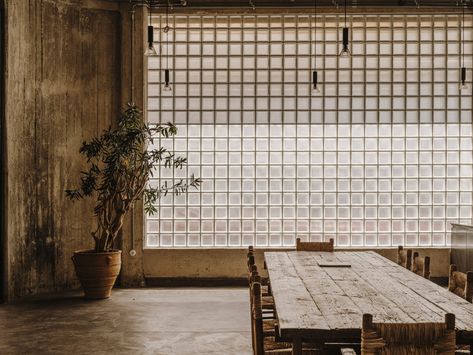 Raw concrete penthouse created inside former Athens warehouse Openhouse Magazine, Andrew Trotter, Glass Blocks Wall, Tile Walls, Moody Interiors, Geometric Floor, Cafe Ideas, Glass Brick, Cosy Living Room