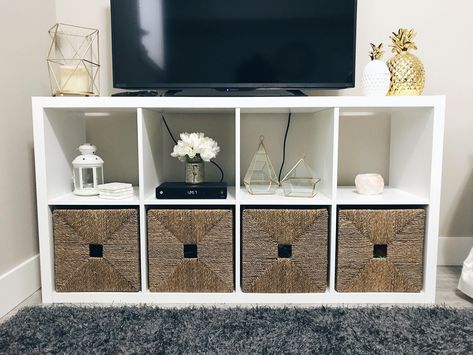 #KALLAX #shelving from #IKEA used as a TV stand, featuring #KNIPSA #baskets with #gold and #white accents. #tvstandideas Tv Stand Ikea, Ikea Deco, Ikea Tv Stand, Ruang Tv, Bedroom Tv Stand, Ikea Tv, Tv Stand Decor, Play Kitchens, Diy Tv Stand