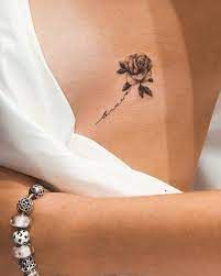 Rose Underboob Tattoo, Tattoo Crane, Rose Tattoo On Side, Underboob Tattoo Designs, Rib Tattoos For Women, Small Girly Tattoos, Feminine Tattoo Sleeves, Rose Tattoos For Women, Small Tattoos With Meaning