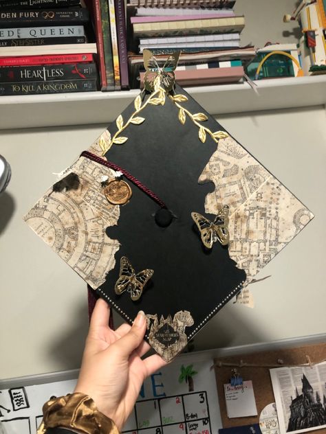 Museum Graduation Cap, Noah Kahan Grad Cap Ideas, Graduation Cap Designs Book Theme, Grad Cap Music Ideas, Hunger Games Grad Cap, Graduation Cap Designs Travel, Senior Hats Decoration, Interior Design Grad Cap, Flat Graduation Cap Decoration