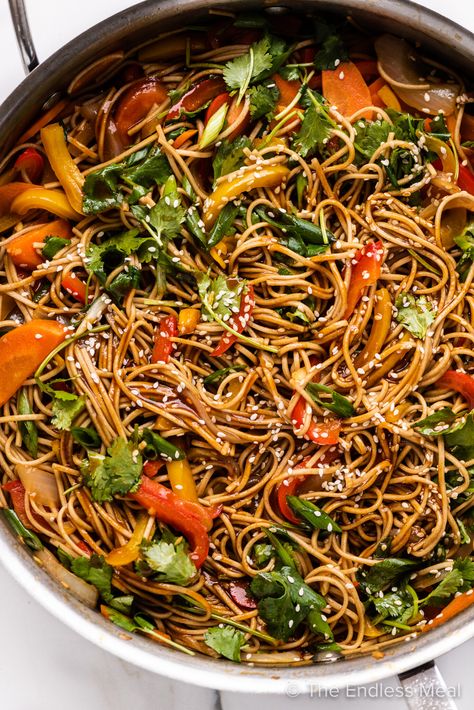 Here's a 20-minute recipe for soy ginger noodles that's delicious, healthy, and quick. It's chewy soba noodles lightly sautéed with tons of fresh vegetables in a savory-sweet soy ginger sauce. Keep it vegetarian or top it with your favorite protein (chicken, beef, pork, shrimp, tofu, etc.) for a complete meal. It's a better-than-take-out dish that can be served warm or cold, and leftovers make a tasty lunch! #theendlessmeal #soygingernoodles #noodles #pasta #takeout #vegetarian #stirfry Pork Soba Noodles, Soy Sauce Veggies, Cold Soba Noodle Recipe, Spicy Soba Noodles, Ginger Noodles, Shrimp Tofu, Soy Sauce Noodles, Soy Ginger Sauce, Soba Noodles Recipe