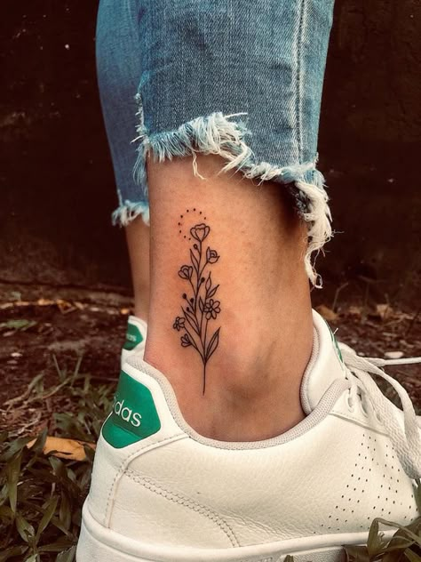 Flower bouquet ankle tattoo Women Tattoos Nature, Tattoo Placement For Women Leg, Back Of Foot Tattoo, Flowers On Ankle Tattoo, Small Unique Tattoos Women, Achilles Tattoo Placement, Interesting Tattoos For Women, Flower Tattoos Ankle, Side Of Foot Tattoo