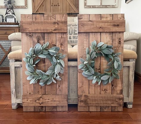 Add a touch of rustic farmhouse charm to your home with this Wood Shutter Wall Decor including a Lambs Ear Wreath. Measuring 14" x 30", this unique piece is perfect for adding a pop of greenery and texture to any space. Each shutter is handcrafted and no two are exactly alike, making it a truly one-of-a-kind addition to your decor. Whether you're looking to create a beach house vibe or simply want to add a touch of farmhouse style, this wall decor is sure to impress.  Hanging hardware is include Window With Shutters Wall Decor, Wreaths For Bedroom Wall Decor, Bedroom Wall Decor Rustic, Shutter Ideas For Inside, Diy Shutters Indoor Wall Decor, White Shutters Living Room, Window Shutters Decor, Farmhouse Shutters Decor, Window Shutter Crafts