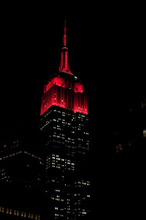 April 26, 2015: Tonight, the Empire State Building illuminates its tower in red to celebrate the 50th anniversary of WNJU Telemundo 47, a staple of NYC-area television programming since 1965! New York Red Aesthetic, Project 50 Aesthetic, Red City Aesthetic, Dark Naturalism Aesthetic, Empire Aesthetic, Red Building, Red City, Red And Black Wallpaper, Red Rain