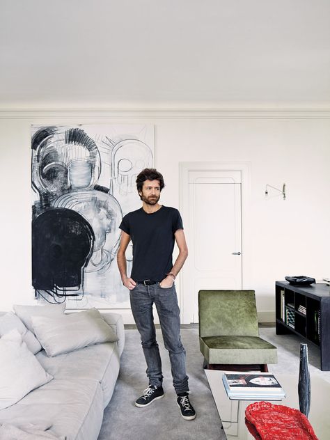 Dirand beside a Living Divani modular sofa: “It’s the first time I buy something as comfortable as that!” he says. The charcoal drawing is by Thomas Houseago. Paris Apartment Living Room, Joseph Dirand Interiors, Minimal Apartment, Joseph Dirand, Minimalist Apartment, Apartment Tour, Apartment In Paris, Parisian Apartment, Design Apartment