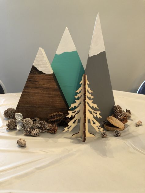 Adventure Awaits painted wood mountain centerpieces Adventure Theme Centerpieces, Mountain Theme Party Decorations, Mountain Party Decorations, Let The Adventure Begin Centerpieces, Mountain Theme Retirement Party, Adventure Awaits Centerpiece Ideas, Mountain Theme Centerpieces, Hiking Centerpieces, An Adventure Awaits Baby