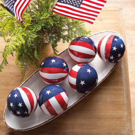 PRICES MAY VARY. Foam Add a patriotic look to home decor or other decorative pieces with these stars and stripes orbs. A great addition to Fourth of July decorations, these orbs look great in buckets, pails or any other container that needs a boost of patriotism. Display these orbs on the Fourth of July or any other patriotic holiday – or anytime of year when you want to show off your pride in the USA! Foam. (6 pcs. per unit) 3 1/2" diam. Foam. (6 pcs. per unit) 3-1/2" diam. Patriotic Christmas Decorations, Patriotic Decorations Diy, Decorative Orbs, Bucket Decor, Patriotic Tiered Tray Decor, Patriotic Decorations Party, Military Christmas, Indoor Holiday Decor, July Desserts