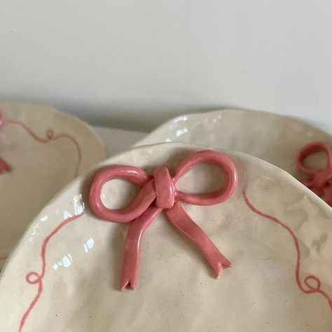 Myo Studio on Instagram: "guys!!! i can’t believe there is so much love around these little dishes. 🎀 i thought about them one day with the intention to create something to place my jewelry. I made so many bows now that you can expect many collections in the future 🫢" Bow Jewelry Dish, Bow Pottery, Clay Coquette, Pottery Jewelry Dish, Heart Jewelry Dish, Ceramic Jewelry Dish, Clay Works, Coquette Girl, Diy Ceramic