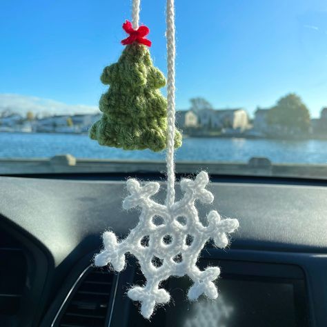 For all Christmas/winter/holiday season lovers!! These Christmas tree and snowflake hanging accessories are perfect decoration for your tree or even as a car mirror accessory! 🎄❄️ These are handcrafted with so much love and care, and are made in a loving, non-smoking home! YOUR PURCHASE INCLUDES: One crochet Christmas tree and snowflake car accessory! MEASUREMENTS: The tree measures approximately 2 inches tall, and the snowflake measures approximately 1.5 inches tall! Tiny and sweet for displaying as a decoration on your car mirror!  MATERIALS:  ➖100% acrylic yarn CARE INSTRUCTIONS:  ➖Recommended to spot clean with water and mild soap, if needed! ➖Treat with gentle care! Even though the parts are securely fastened, rough treatment may cause them to loosen. DISCLAIMER: ➖It could pose a cho Crochet Christmas Hanging Decorations, Christmas Crochet Car Accessories, Crochet Christmas Car Charm, Christmas Tree Crochet Decorations, Crochet Car Accessories Christmas, Crochet Car Mirror Hanging Christmas, Christmas Car Accessories, Crochet Winter Decoration, Winter Crochet Decor