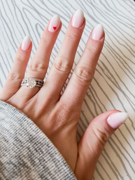 White Almond Nails With Pink Heart, Nails With One Heart On Ring Finger, Pink Ombre Nails With Hearts, Small White Heart Nails, Dip Powder Nails Heart Design, Ombre With Heart Nails, Valentines Nails Almond Shape Pink, White Nails With A Pink Heart, Ombre Nail With Heart