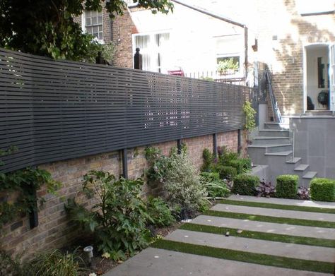 Contemporary trellis attached to preexisting wall Trellis On Top Of Wall, Modern Garden Trellis, Garden Fence Decoration, Contemporary Trellis, Garden Fence Panels, Garden Privacy, Back Garden Design, Garden Makeover, Walled Garden