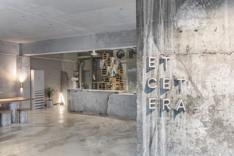 jeonghwa seo crafts brutalist concrete interior for etcetera cafe in seoul Seoul Cafe, Concrete Interiors, Cafe Shop Design, Coffee Shops Interior, Aluminum Furniture, Coffee Shop Design, Glass Facades, Cafe Interior Design, Cafe Shop