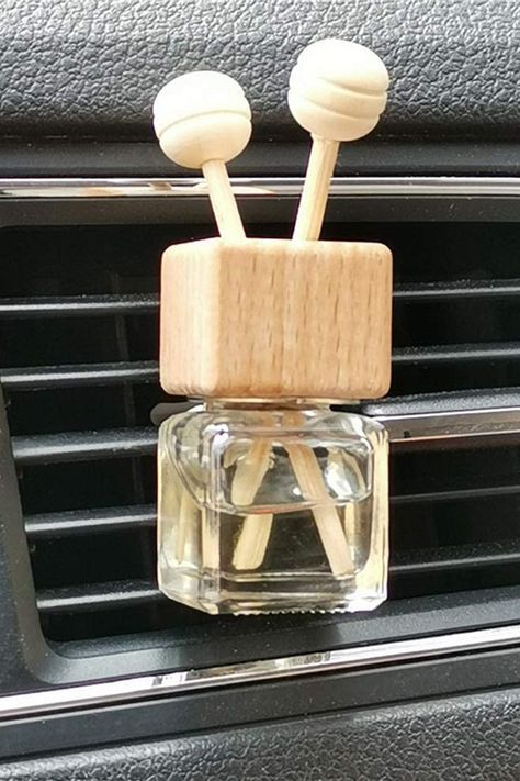 Keep your car smelling fresh long after the new car scent has vanished by unleashing the refreshing scent of your favorite essential oils instead. Air Freshener, Glass Jar Storage, Reed Diffuser Sticks, Wood Car, Diffuser Sticks, Car Smell, Jar Storage, Car Diffuser, Smells Amazing