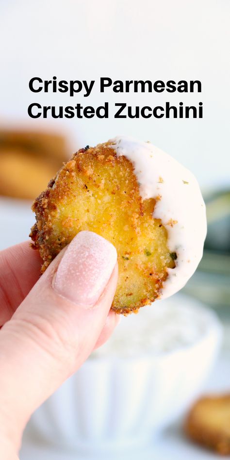 A picture of a crispy zucchini chip dipped in ranch dressing. Zucchini Garlic Bites, Parmesan Zucchini Bites, Garlic Bites, Fried Zucchini Recipes, Parmesan Crusted Zucchini, Zucchini Appetizer, Zucchini Crisps, Zucchini Bites, Easy Zucchini Recipes