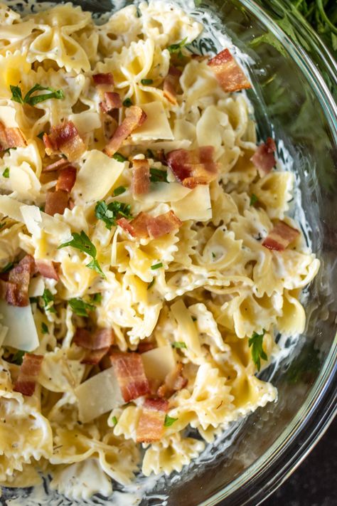 Creamy Bow Tie Pasta with bacon is simple comfort food that is easy to customize with grilled chicken, veggies, or delicious as is. With only seven ingredients and 30 minutes, you can have a family favorite on the table. | www.persnicketyplates.com Bacon Bow Tie Pasta, Bow Tie Pasta Recipes Healthy, Chicken With Bow Tie Pasta, Chicken Pasta Recipes Bowtie, Bacon Bowtie Pasta, Bow Ties Pasta Recipes, Chicken Bacon Bowtie Pasta, Bow Tie Chicken Pasta Salad, Bow Tie Pasta And Chicken Recipes