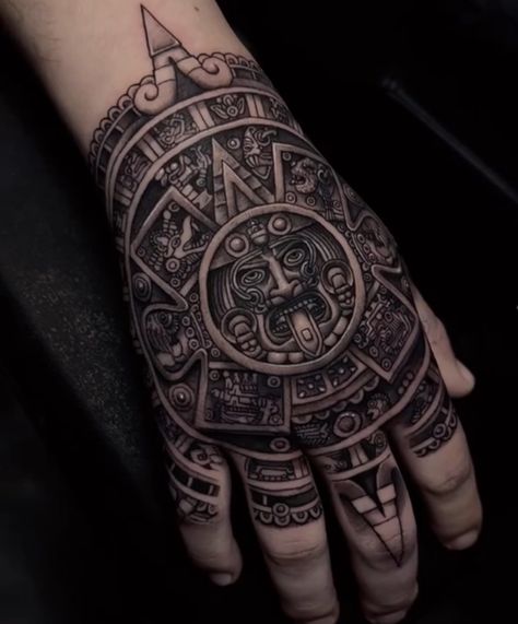 Aztec Calendar hand tattoo Aztec Necklace Tattoo, Aztec Filler Tattoo, Tattoo Ideas Aztec Mexican, Aztec Tattoo Sleeve Men, Aztec Hand Tattoos For Guys, Mayan Hand Tattoo, Aztec God Tattoo For Men, Aztec Tattoo Ideas For Men, Aztec Tattoo Mexican Men