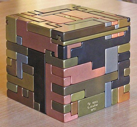 5" sq all metal puzzle. Pieces must be slid in a special sequence, hidden keys and hidden storage space. Idea from Japanese puzzle boxes. De Stijl, Japanese Puzzle Box, 3d Maze, Cnc Manufacturing, Japanese Puzzle, Puzzle Boxes, Woodworking Tools Workshop, Metal Puzzles, Window Projects