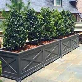 long, custom grey planter with X pattern design on front Extra Large Outdoor Planters, Railing Flower Boxes, Front Yard Planters, Driveway Landscape, Yard Planters, Boxwood Landscaping, Long Driveway, Long Planter, Large Backyard Landscaping