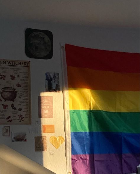 room/aesthetic/pride flag/inspiration Aesthetic Pride Flag, Pride Flag Outside House, Pride Flag Decoration, Lgbtq Flags Aesthetic, Trans Flag On Wall, Pride Room Aesthetic, Masc Lesbian Room Decor, Queer Flag Aesthetic, Pride Flag In Bedroom