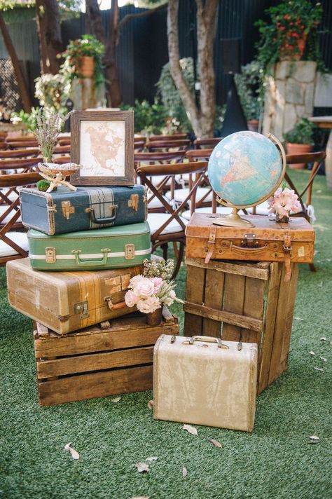 traveler wedding decor with stacked luggage and globe Travel Theme Bridal Shower, Travel Bridal Showers, Travel Baby Shower Theme, Travel Baby Showers, Travel Party Theme, Adventure Baby Shower, Adventure Theme, Malibu Wedding, Outdoor Hanging Lanterns