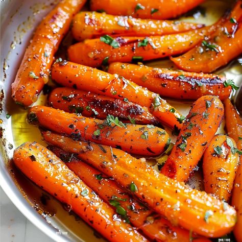 Elevate your side dish game with these Honey Garlic Butter Roasted Carrots, a delectable blend of sweet honey, savory garlic, and rich butter that transforms ordinary carrots into a culinary masterpiece. This easy-to-make recipe is ... READ MORE Butter Roasted Carrots, Carrots In Oven, Roasted Baby Carrots, Baby Carrot Recipes, Honey Carrots, Carrots Side Dish, Butter Carrots, Honey Roasted Carrots, Easy Family Recipes