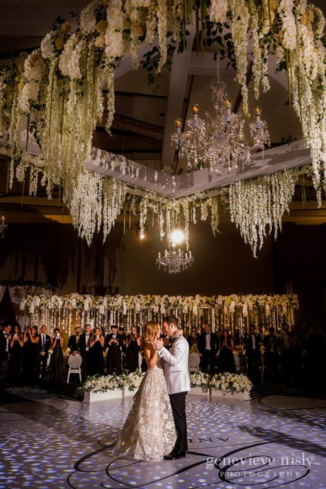 First dance under a canopy of beautiful flowers at the Hilton Downtown Cleveland Wedding with  Kara & Jeremy by Genevieve Nisly Photography Salon Wedding Decoration, High Ceiling Wedding Decor, Wedding Salon Decoration, Ideas Para Decorar Bodas En Salon, Ceiling Flowers Wedding, Wedding Decorations Ceiling, Floral Ceiling Wedding, Hanging Floral Decor, Wedding Ceiling Decorations