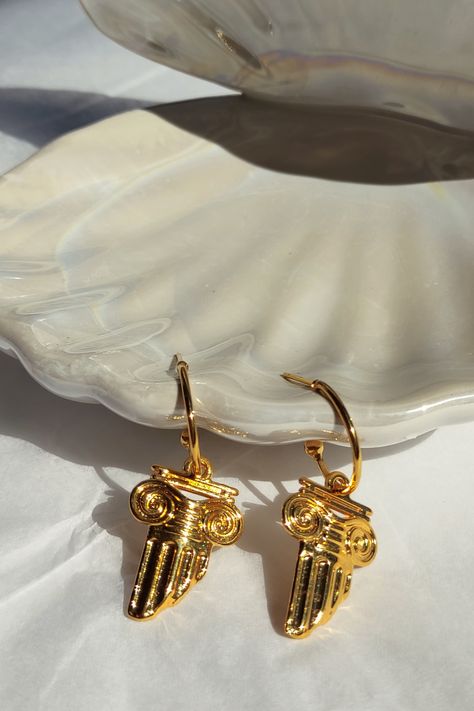 ☙ Gold half hoops with charm column motifs in Grecian aesthetic. These earrings are inspired by Greek architecture and mythology and they are lightweight and comfortable to wear with your casual outfits. You can offer them, as a souvenir, to a friend that visited Greece and loved it, as a bridesmaid gift, a birthday gift etc. ❧ Details : ❥ Column size : 2.5x1.7 cm ❥ Earrings length : 3.9 cm ≈ 1.5 inches ❥ Earrings weight : 0.004 kg www.etsy.com/shop/LeChatAccessories Lyre Playing, Grecian Aesthetic, Arcana Oc, Hermes God, Widow Aesthetic, Greek Accessories, Greek Earrings, Greek Aesthetic, Hoops With Charms