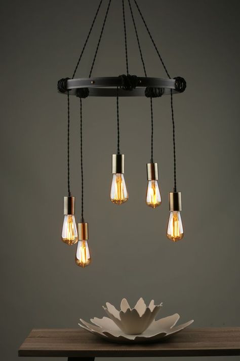 This is a five light metal and wooden light pendant. It would look great in an industrial design or even a gothic styled room. It has vintage cable and each lamp is adjustable by wrapping the braided cable around the frame of the light pendant fitting. Industrial Lamp Design, Industrial Hallway, Vaulted Ceiling Lighting, Spider Light, Vintage Industrial Lighting, Cluster Pendant Lighting, Wooden Light, Dar Lighting, Industrial Lamp