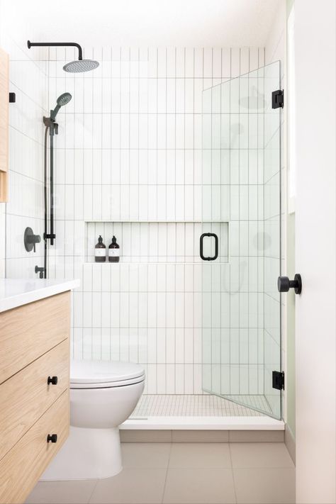 Modern White Bathroom Shower by Alykhan Velji Designs Scandinavian Shower Tile, 4x16 Vertical Subway Tile Bathroom, Inexpensive Shower Tile, Artisan Frost Ceramic Tile Bathroom, Corporate Bathroom, Vertical Subway Tile Bathroom, Vertical Shower Tile, Shower Ledge, White Subway Tile Shower