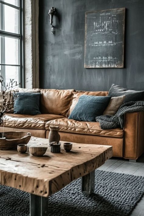 Bring an urban, industrial edge to your living room with exposed brick, metal accents, and rustic furniture. Use leather sofas, metal coffee tables, and vintage-inspired lighting to create a cozy yet edgy space that combines warmth and modernity. 🏙️🛋️ #IndustrialLiving #UrbanDecor #EdgyDesign Industrial Cozy Living Room, Minimalist Industrial Interior Design, Industrial Boho Living Room, Living Room With Exposed Brick, Warm Industrial Living Room, Industrial Cozy, Boho Industrial Living Room, Eco Industrial, Industrial Rustic Decor