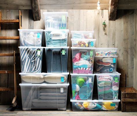 See-through storage boxes filled with clothing and toys piled up in an orderly manner against an attic wall. Ikea Storage Bins, Ikea Samla, House Closet, Ikea Usa, Casa Clean, Ikea Website, How To Store Shoes, Ikea Storage, Tiny Spaces