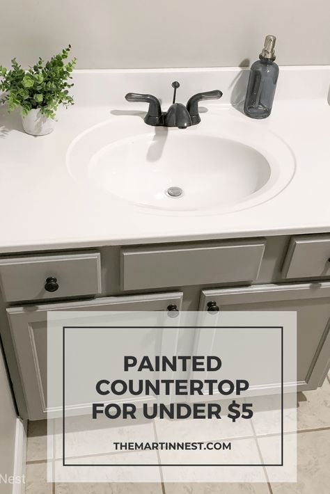 Update an outdated bathroom counter top for under $5 using spray paint.   The post Painted Bathroom Sink for under $5 appeared first on themartinnest.com. #bathroommakeover #paintedcountertop #paintedsink #guestbathroom #rustoleum Bathroom Sink Makeover Diy, Tile Bathroom Sink Countertop, Easiest To Clean Bathroom Design, Small Master Bath Colors, Paint Bathtub Diy, Traditional Rustic Bathroom, Seashell Sink Makeover, Painted Countertops Diy Bathroom, Trailer House Bathroom Remodel