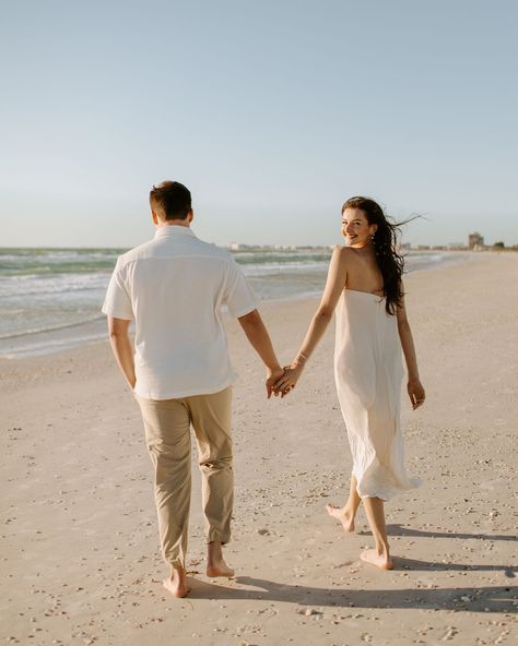 A very windy day turned into one of my fave engagement shoots 💍🌬️ Eric + Abby have the sweetest love and I am so happy I got to document this time for them!! Also isn’t her dress incredible!? There’s something about simplicity that is so elegant!! ✨ [beach engagement, engagement photos, St Pete beach photographer, st Pete photographer, Florida wedding photographer, beach engagement photos, documentary style photos, documentary photography] Tripod Beach Pictures, Maui Engagement Photos, Fun Beach Engagement Photos, Beach Picnic Engagement Photos, Casual Beach Engagement Photos, Lakeside Photoshoot, Cabo Pictures, Bali Photoshoot, Beach Engagement Photos Outfit