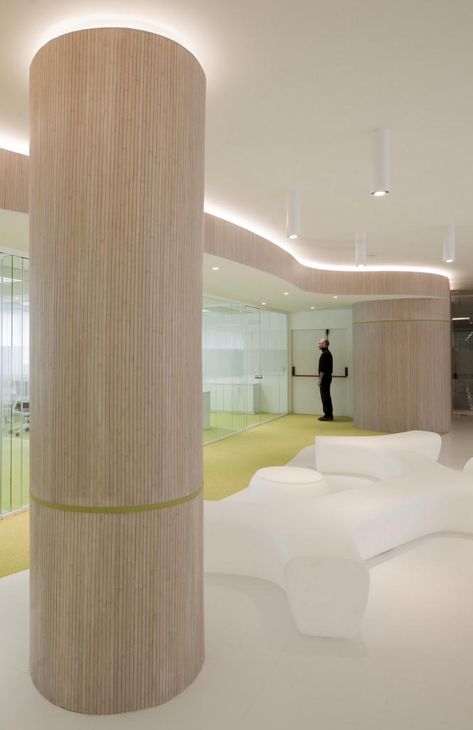 The Santander International Entrepreneurship Center | Office Snapshots Column Decoration Ideas, Columns Interior, Column Cladding, Modern Column, Columns Decor, Column Decoration, Atrium Design, Column Lighting, Corporate Interior Design