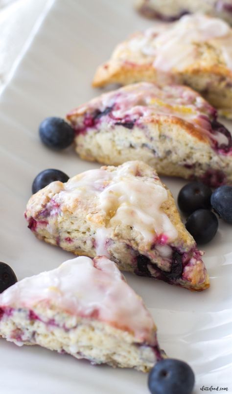 These mini mixed berry scones are full of blueberries and raspberries and drizzled with a sweet lemon glaze. A simple and elegant breakfast, brunch, or dessert! And, ready for any 4th of July party! Christmas Coffee Cake, Cranberry Christmas Cake, Christmas Cake Recipe, Berry Scones, Mini Scones, Cranberry Christmas, Cranberry Cake, Dog Treats Homemade Recipes, Christmas Cake Recipes