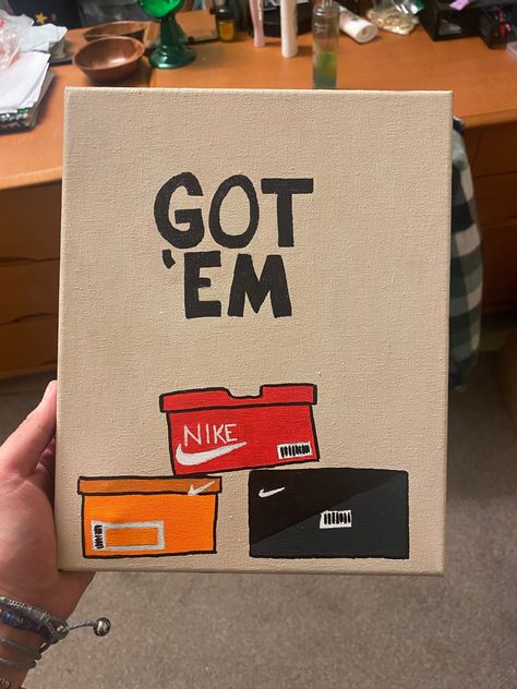 If you are a shoe lover like me, you will love this painting!! The term "Got em" is from the Nike app called SNKRS. This is an 8x10 canvas with acrylic paint and sharpie paint markers. Things To Paint With Paint Markers, Painting Names On Canvas, Things To Do On A Canvas, Painting Canvas Ideas Aesthetic, Nike Painting Canvas, Painting On A Black Canvas, Paintings With Markers, Acrylic Paint Markers Art, Acrylic Painting Ideas On Canvas Aesthetic